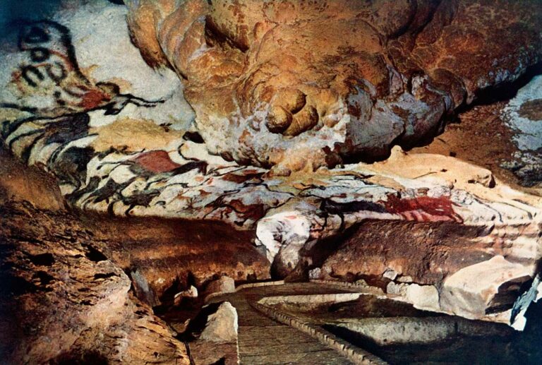 Ancient cave paintings in Lascaux, France showcasing prehistoric art with vibrant colors and historical significance