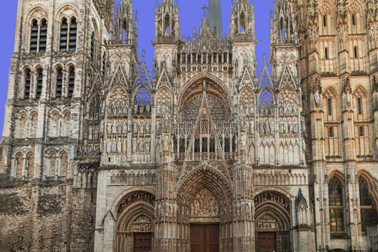 Detailed view of Rouen Cathedral, showcasing its Gothic architecture and intricate façade, a popular tourist attraction in France.
