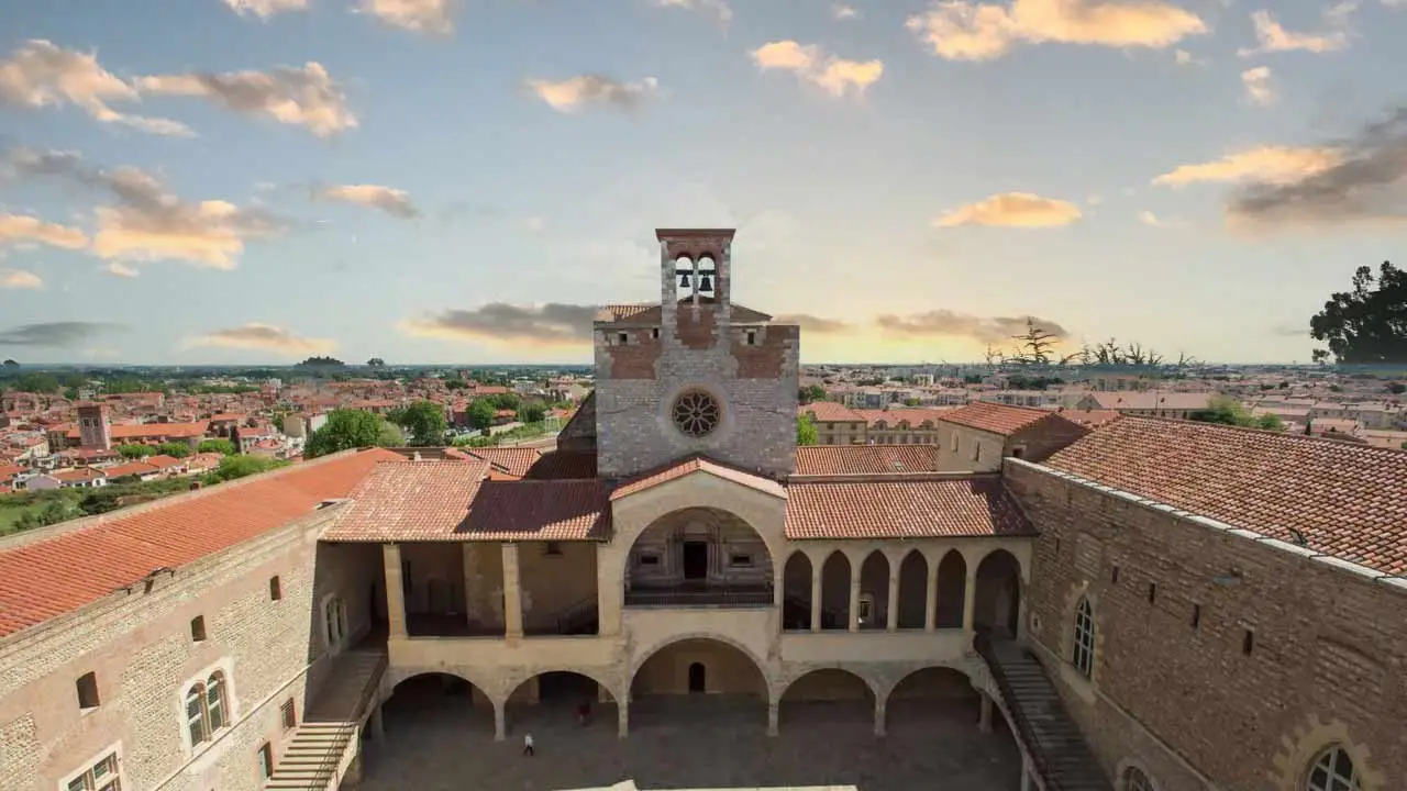 sun setting over the Palace of the Kings of Mallorca in perpignan