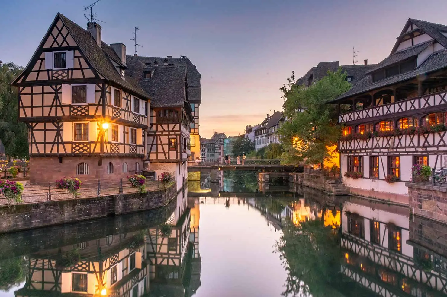 guests enjoying a walking tour over canal of petite venice in Strasbourg